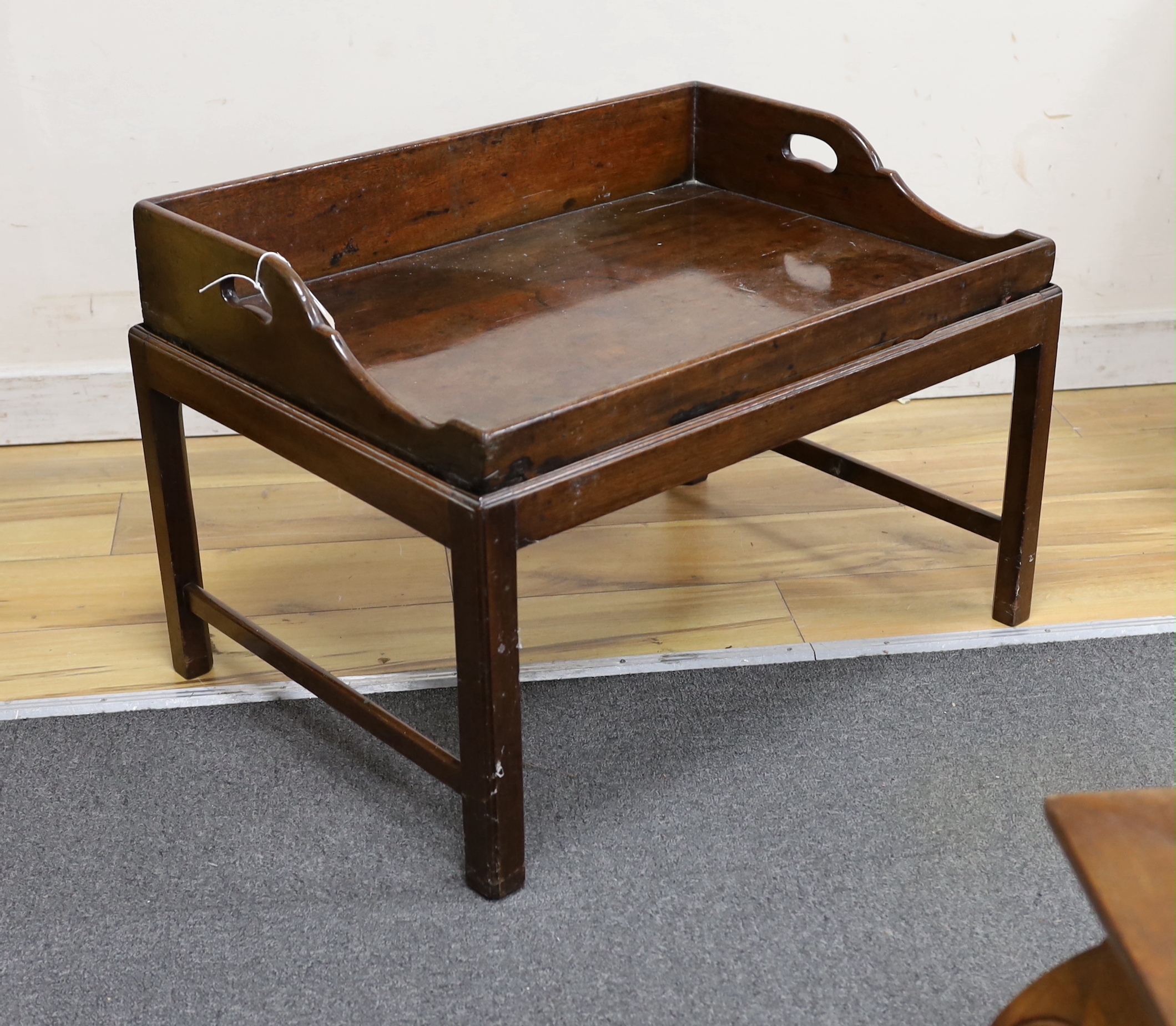 A Victorian rectangular mahogany butler's tray on associated stand, width 69cm, depth 50cm, height 47cm